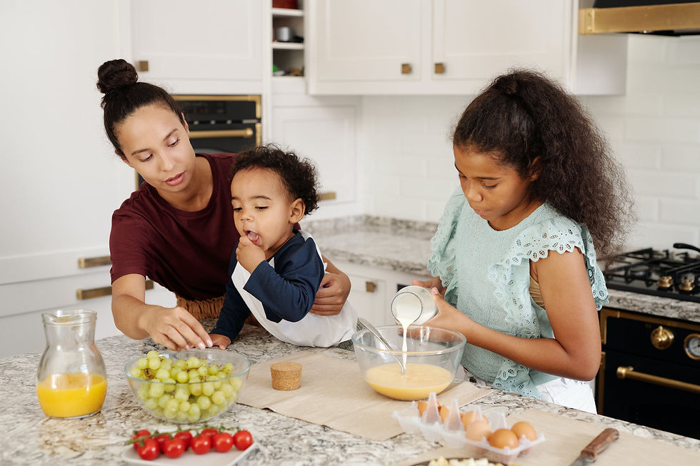 A family at a table, eating grapes