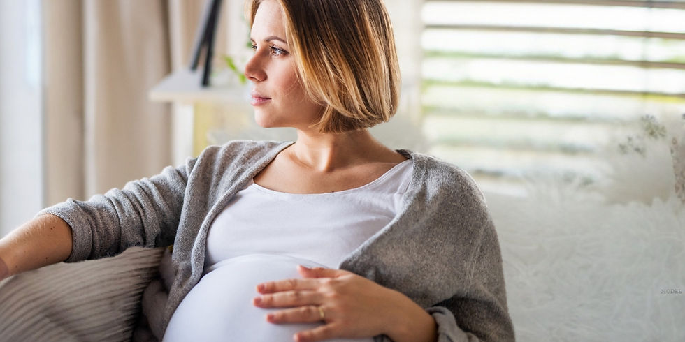 A pregnant woman in conversation with another woman
