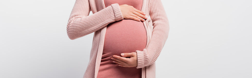 Woman wit arms around her pregnant stomach