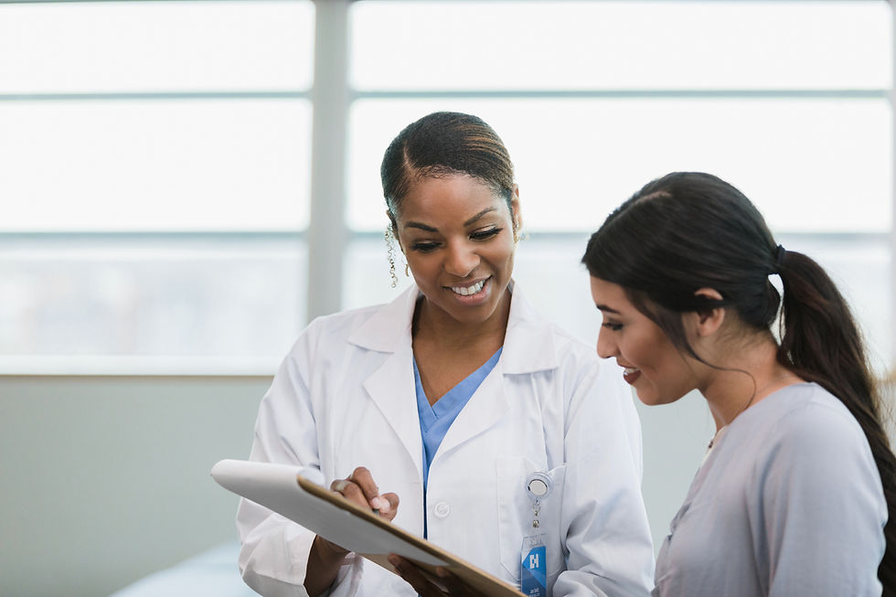 Doctor showing her patient a paper on a clipboard